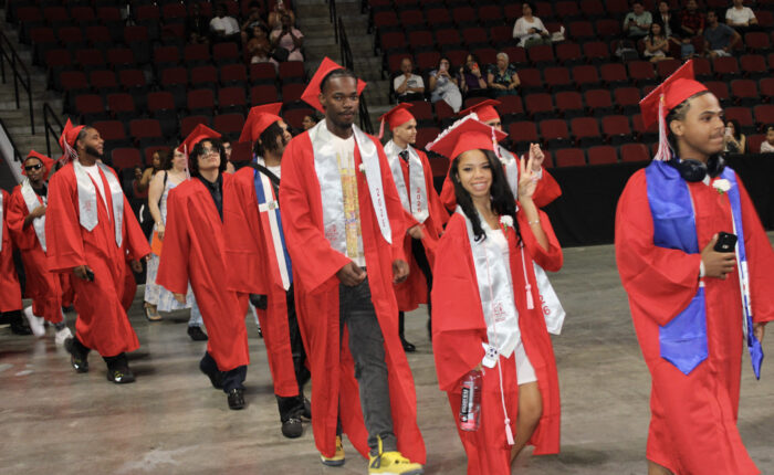 MP 2026 graduates walk into BU Agganis Arena.