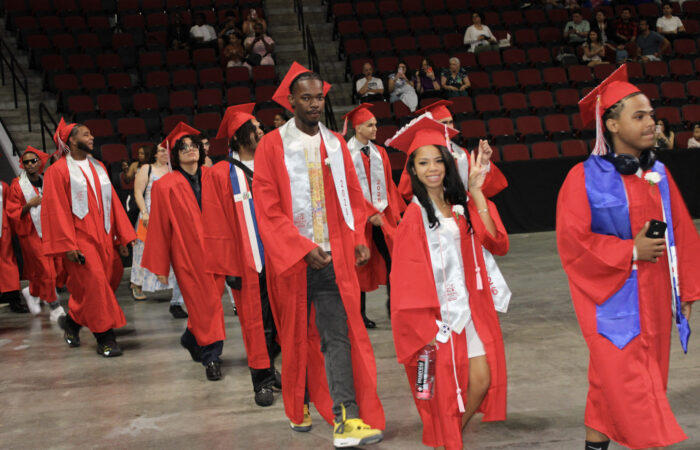 MP 2026 graduates walk into BU Agganis Arena.